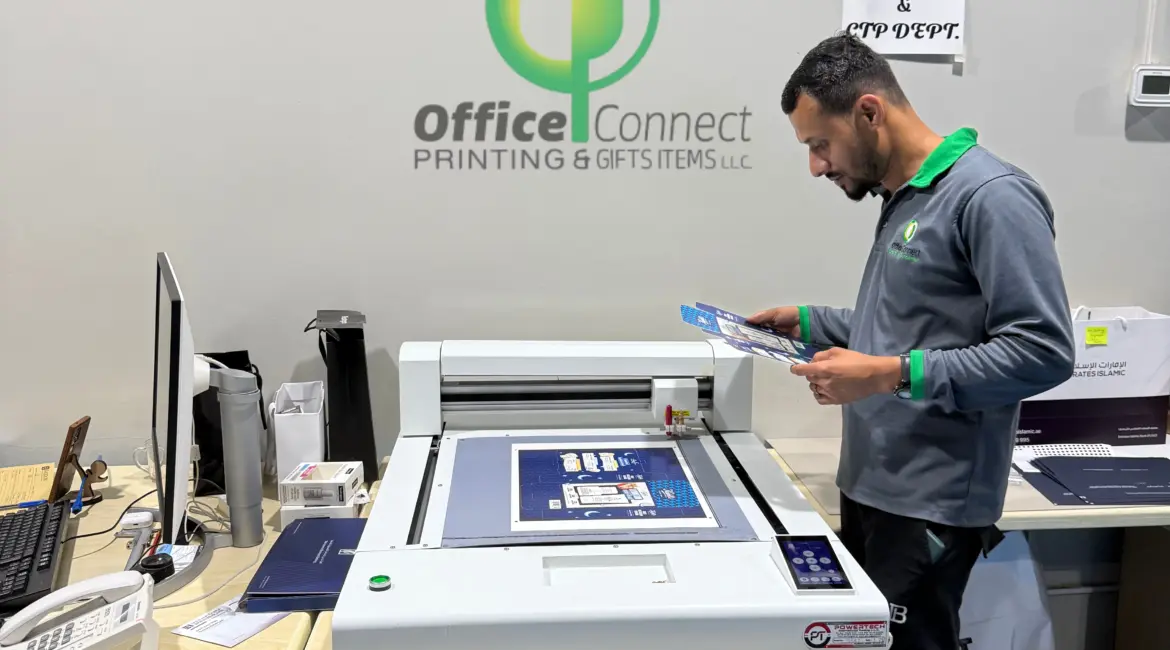 Professional printing services in Dubai showing print production and finishing process